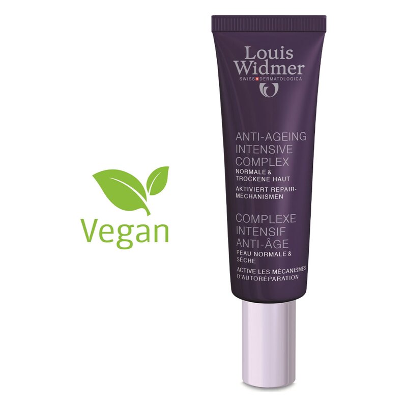 Röhrenförmige Verpackung des Louis Widmer Anti-Ageing Intensive Complex in lila, beschriftet mit veganem Symbol.