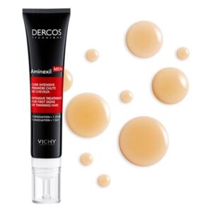 Ein schwarzes Röhrchen mit weißer und roter Beschriftung, umgeben von mehreren Tropfen einer hellen, gelartigen Substanz.