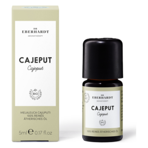 Flasche mit ätherischem Cajeput-Öl (5 ml) in schwarzer Verpackung neben einer hellgrünen Schachtel.