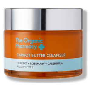 Oranger Tiegel mit Karottenbutter-Reinigungsmittel, ausgestattet mit einem silbernen Deckel, für alle Hauttypen.